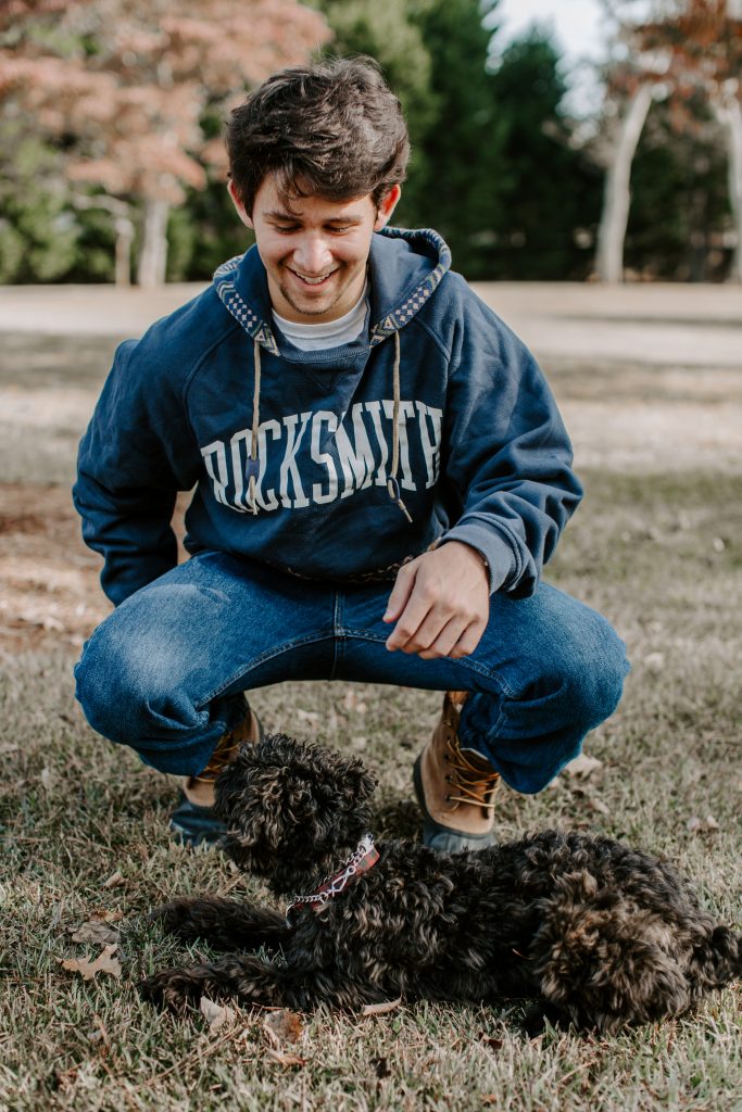 Christian O. Senior pictures collared shirt button up stairs poses pictures baseball senior garden dog and man open field golden hour sweatshirt